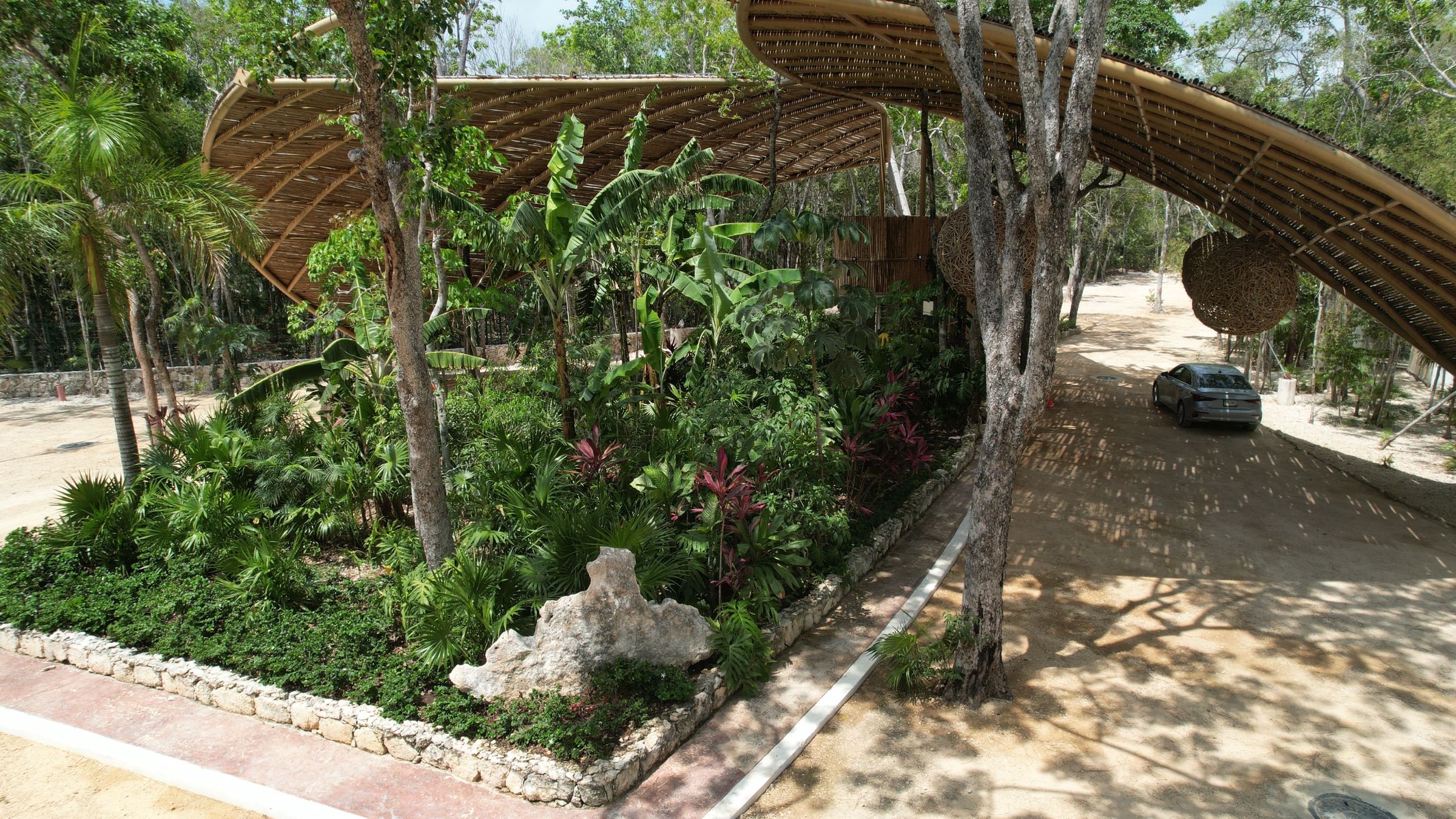 Bamboo entrance pavilion at Axkaba, seen from the driveway