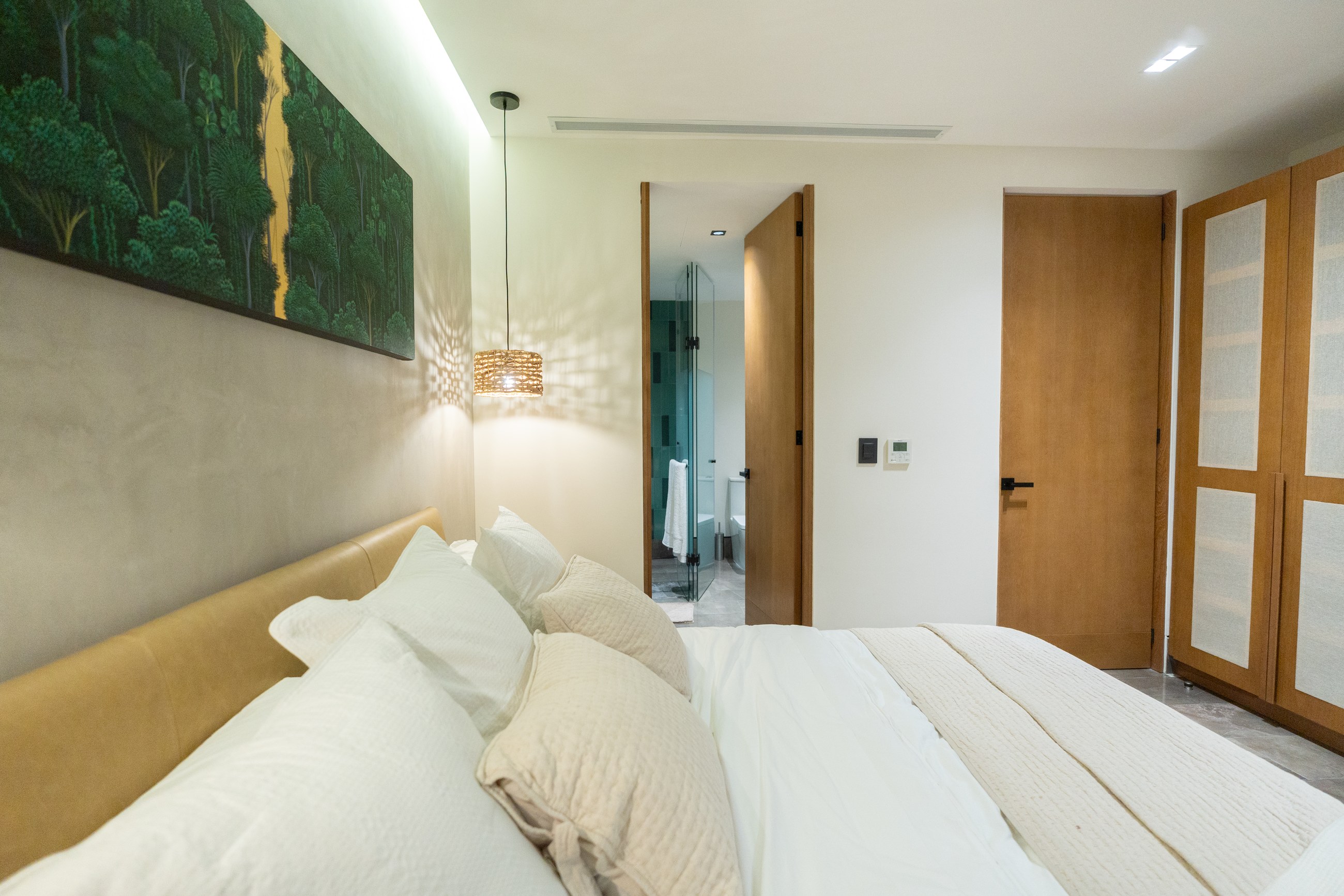 Photograph of the furnished sample unit bedroom, evening