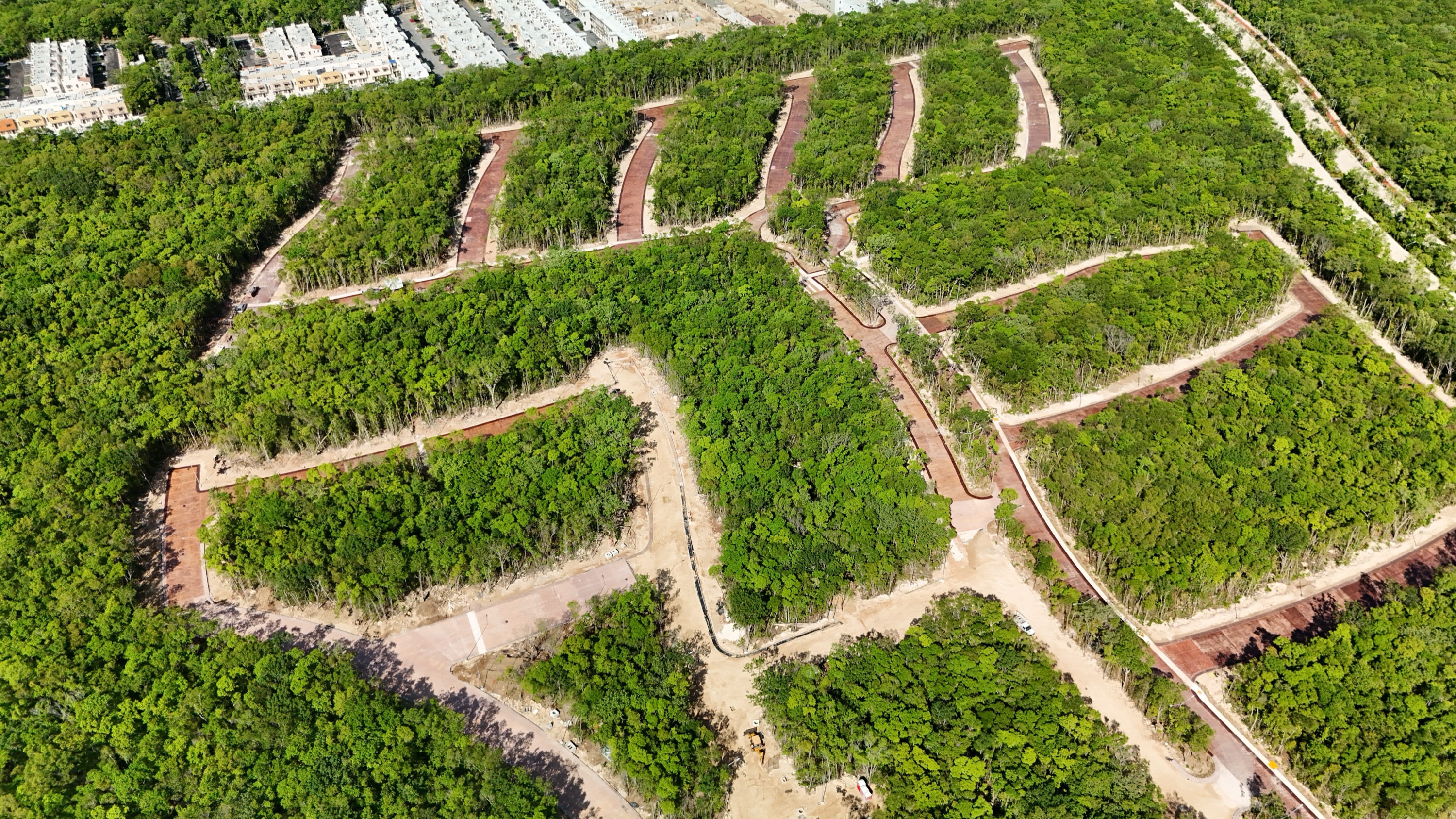Aerial photograph showing finished streets on one side and earthworks still open on the other