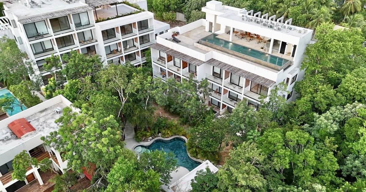 Aerial view of Erena Mindful Apartments, La Veleta, Tulum, showing its rooftop and courtyard pools